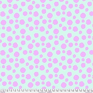 May include: A seamless pattern of light pink polka dots on a light blue background.