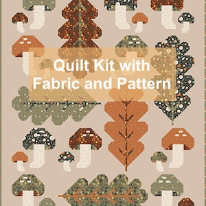 May include: Quilt kit with fabric and pattern featuring a woodland theme with mushrooms, trees, and leaves in shades of brown, green, and white.