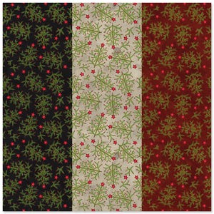 May include: A fabric swatch featuring three vertical panels in black, cream, and deep red. Each panel is decorated with a repeating pattern of green pine branches and small red stars scattered across the surface in a consistent, uniform layout.
