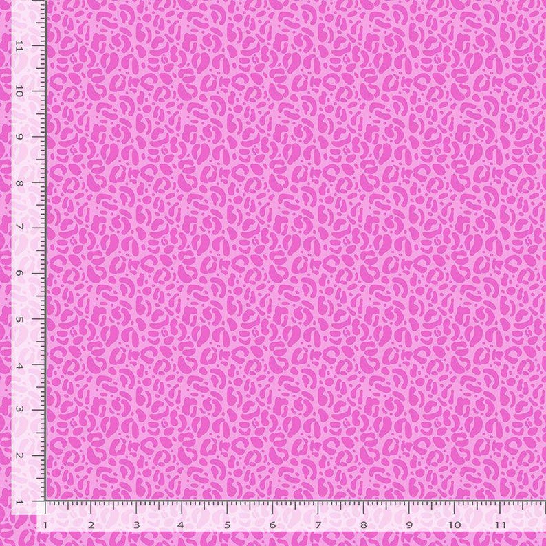 May include: Pink fabric with a repeating pattern of small, irregular pink spots. The fabric has a subtle sheen.