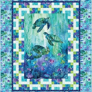 May include: A colorful quilt featuring an underwater scene with sea turtles and fish. The quilt has a blue, green, and purple color scheme with a patterned border. The central image shows three sea turtles swimming in the ocean.