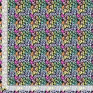 May include: A seamless pattern featuring a repeating design of abstract shapes in a rainbow color gradient on a black background.