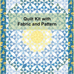 May include: A quilt kit with fabric and pattern. The quilt features a central design of blue and white geometric shapes, with a yellow sunburst pattern in the center. The border is a blue floral pattern with yellow sunflowers.