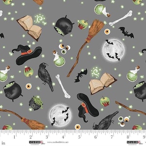 May include: A gray Halloween-themed fabric pattern featuring witch hats, cauldrons, brooms, crows, potion bottles, bones, apples, moons, bats, and open spell books. The design includes glowing stars and is suitable for various craft projects.
