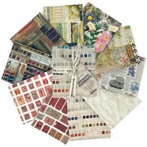 May include: A collection of patterned paper sheets arranged in a circular shape. The designs include floral, vintage ticket stubs, watercolor palettes, and book pages. A ribbon with "ECLECTIC ELEMENTS" text is tied around some sheets.
