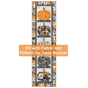May include: A Halloween-themed table runner kit with fabric and pattern. The design features orange pumpkins, black crows, and the text "Full Moon, Black Hocus, Magic Pocus, Fall." The runner has a rectangular shape with a repeating pattern.