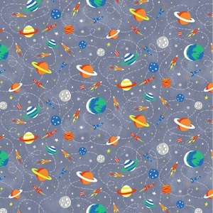 May include: A seamless pattern featuring a variety of planets, stars, and rockets on a blue background. The planets are in various colors, including orange, yellow, green, and blue. The rockets are red and white. The stars are white.