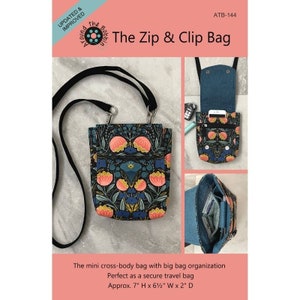 May include: A floral print cross-body bag with a black strap. The bag features a colorful pattern of flowers and leaves on a dark background. The bag is approximately 7 inches high, 6.5 inches wide, and 2 inches deep.