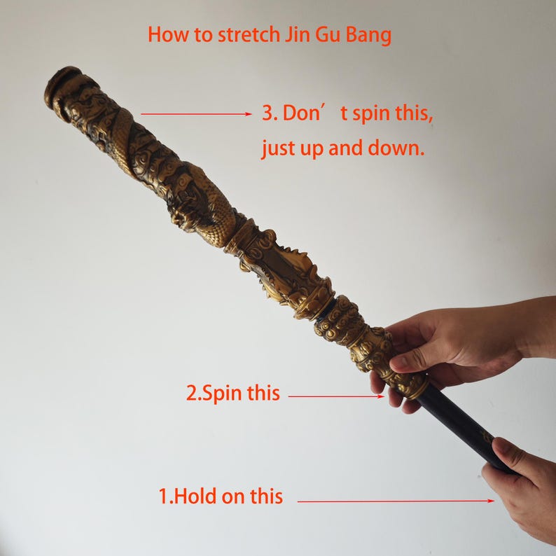 May include: A gold-colored staff with intricate carvings, labeled "How to stretch Jin Gu Bang".  Instructions for stretching the staff are shown with arrows pointing to different sections: "1. Hold on this", "2. Spin this", and "3. Don't spin this, just up and down."