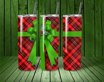 May include: Three stainless steel tumblers with lids and straws. The tumblers are wrapped in a red and black plaid pattern with a green bow and holly.