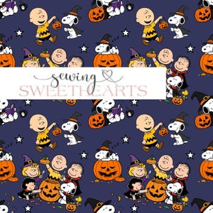 May include: A dark blue fabric pattern featuring Peanuts characters in Halloween costumes, including Snoopy, Charlie Brown, and Lucy. The design includes orange jack-o'-lanterns, white stars, and sweets. A white banner with the text sewing SWEETHEARTS overlays.