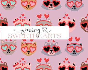 May include: A repeating pattern of cartoon cats with heart-shaped sunglasses and headbands on a pink background. The text "sewing & SWEETHEARTS" is displayed on a white rectangle.