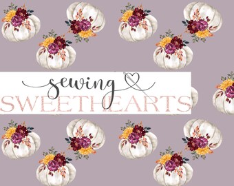 May include: A seamless pattern featuring white pumpkins with burgundy, yellow, and orange floral arrangements on a light purple background. The text "sewing sweethearts" is centred in the image.