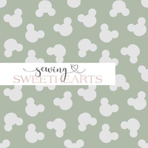 May include: A seamless pattern featuring white Mickey Mouse ears on a sage green background. The text "sewing sweethearts" is centered at the bottom of the image.