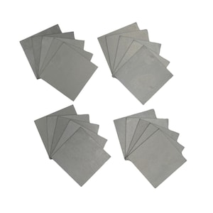 May include: Four stacks of gray, square, paper-like sheets. Each stack contains ten sheets.