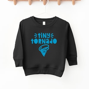 May include: Black sweatshirt with blue text that reads "=tiny= tornado" and a blue tornado graphic.