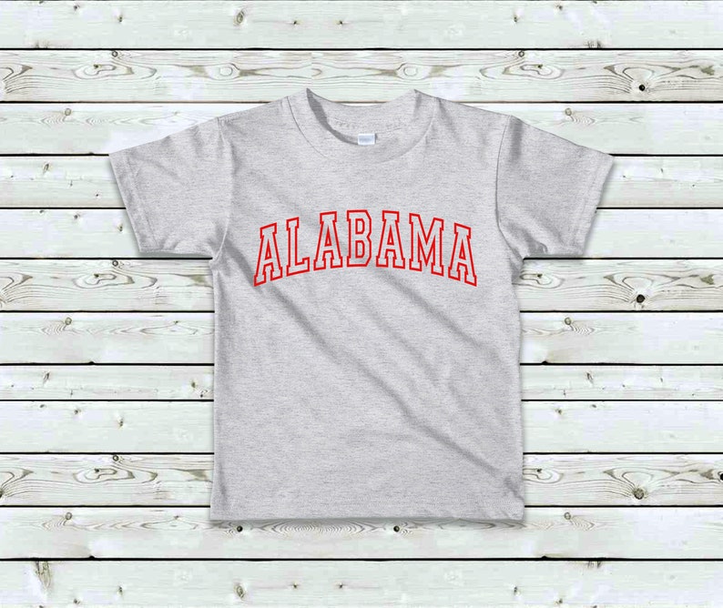 May include: A gray t-shirt with the word "ALABAMA" printed in red on the front.