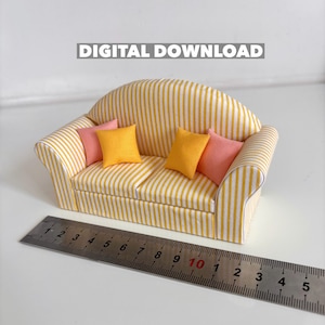 May include: A miniature sofa with yellow and white striped fabric, featuring pink and yellow cushions. The text "DIGITAL DOWNLOAD" is above the sofa. A ruler is placed in front, measuring approximately 25 cm.