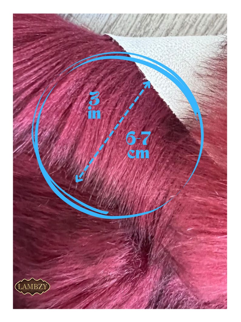 May include: Close-up of a burgundy faux fur fabric. The fur is approximately 3 inches in length. The image includes a blue circle with measurements and the brand name "LAMBZY".