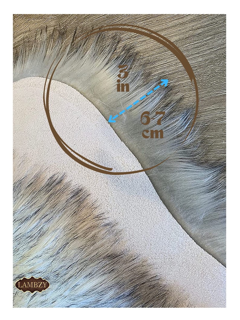 May include: Close-up of a light gray faux fur fabric with a 3 inch by 6.7 cm measurement marked on it.