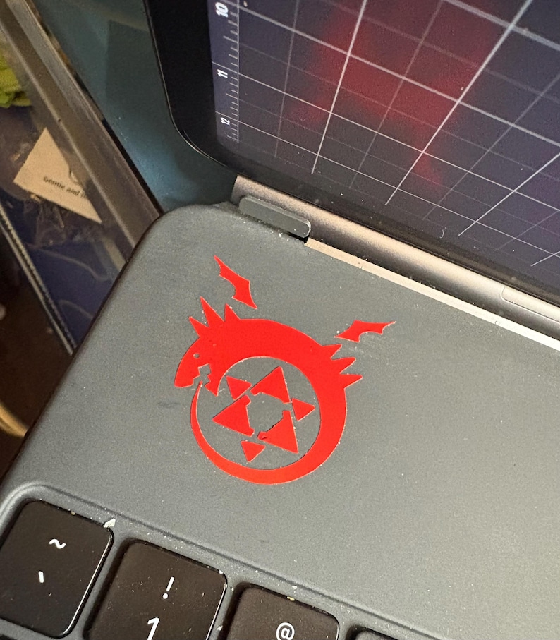 Another example of the Homunculus decal in red placed on an iPad case.