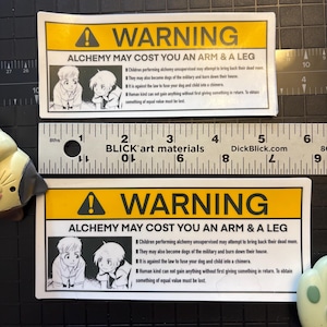 A showcase of both regular and large sizes of the warning sticker.