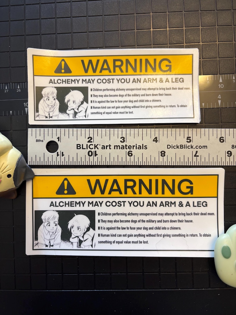 A showcase of both regular and large sizes of the warning sticker.