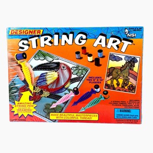May include: A Designer String Art craft kit box featuring the text "Designer String Art" and "Amazing String Pen! As easy as drawing with string!". The box displays a horse illustration, five spools of thread, and four plastic string pens.