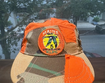 Czapka patchworkowa: naszywka RLPC firmy Maine Sportsman Apparel, materiał w kamuflażu i kolorze pomarańczowym