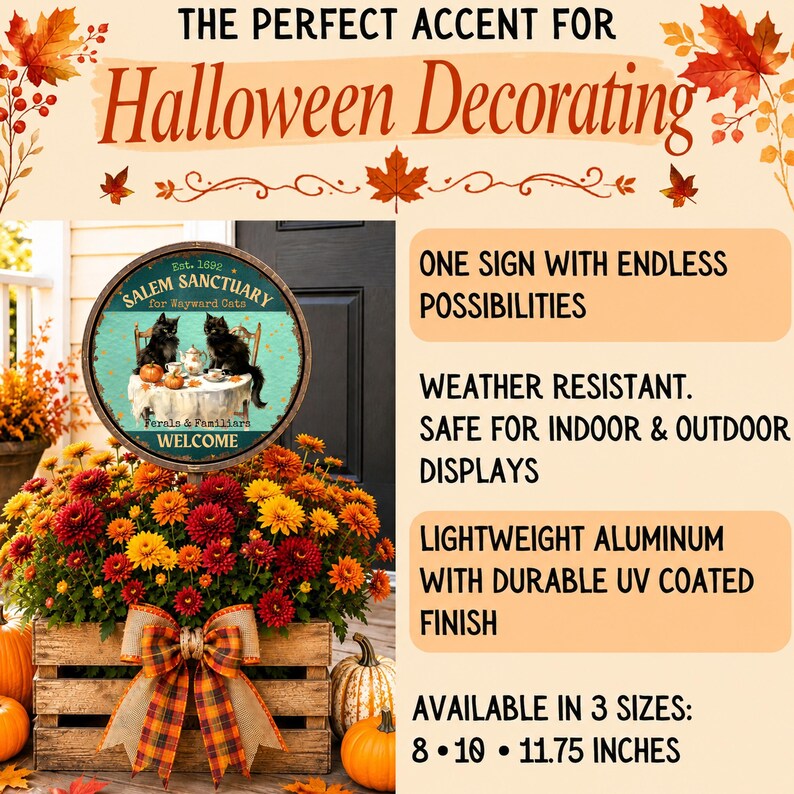 May include: A round metal sign featuring two black cats sitting at a table with pumpkins, labeled Salem Sanctuary for Wayward Cats, Est. 1692. The sign is displayed in a wooden crate filled with orange, yellow, and red chrysanthemums and pumpkins.