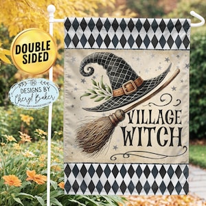 May include: A double-sided garden flag with a black and white diamond pattern border. The center features a witch with a black hat and broom, with the text "Village Witch".