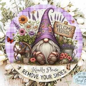 May include: A purple gnome with a white beard sits in front of a welcome sign that says "Welcome Friends". The gnome is surrounded by flowers and lavender in a purple and white plaid background. The sign reads "Kindly Please Remove Your Shoes".