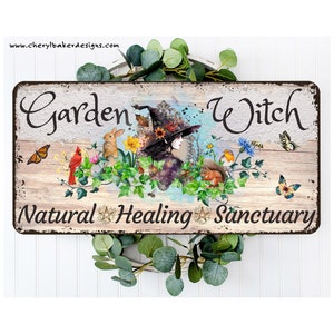May include: A rustic wooden sign with the text "Garden Witch Natural Healing Sanctuary". The sign features a whimsical illustration of a witch with a black hat and flowing purple dress surrounded by flowers, butterflies, and woodland creatures.