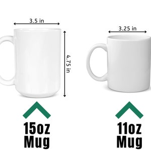 May include: Two white ceramic mugs with measurements in inches. The larger mug is 15oz and the smaller mug is 11oz.