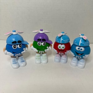 Dispensadores de caramelos Mars M and M con forma de sombrero giratorio o de orejas de conejo, a elección del comprador, 4 unidades