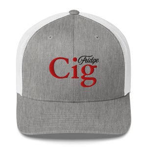May include: A grey trucker cap with a white mesh back. The front of the cap displays the red text "Cig Fridge". The cap has a curved peak and a button on top.