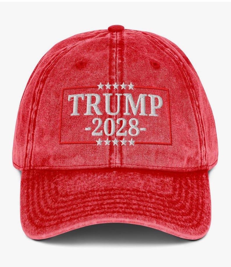 May include: Red vintage style baseball cap with white embroidered text that reads "TRUMP -2028- " with five stars above and below the text.