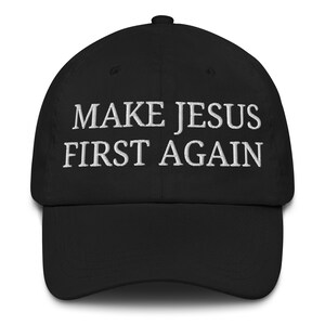 May include: Black baseball cap with white embroidered text that reads "Make Jesus First Again".