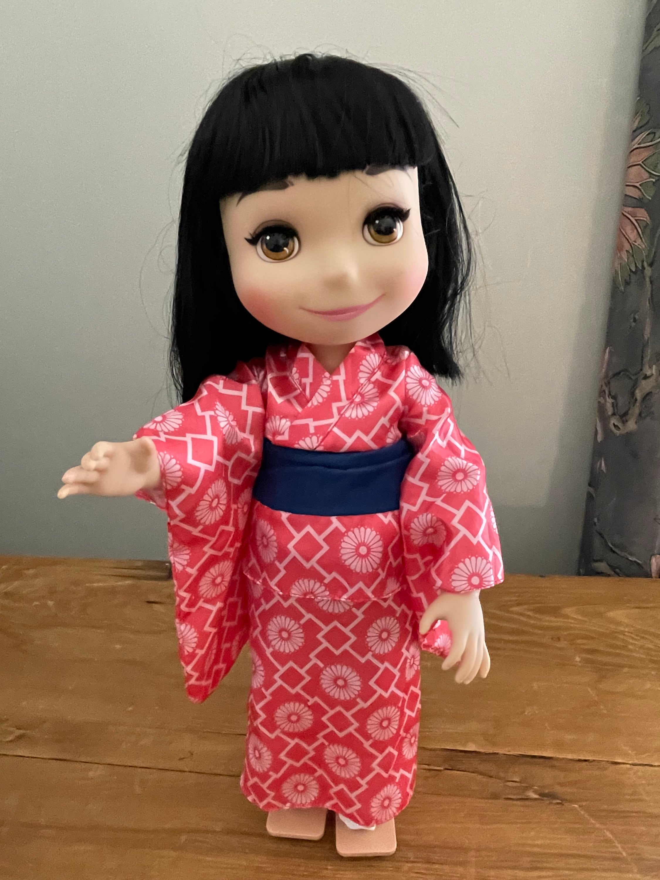 its a small world singing doll