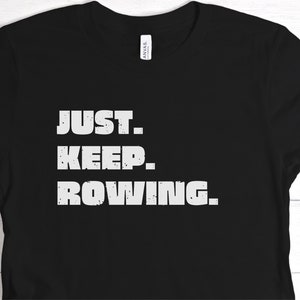May include: Black t-shirt with white text that reads "JUST. KEEP. ROWING."