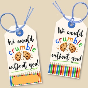 May include: Two cream gift tags with blue string. Each tag has the text "We would crumble without you!" with a broken cookie graphic. One tag has a yellow rectangle and coloured pencils.