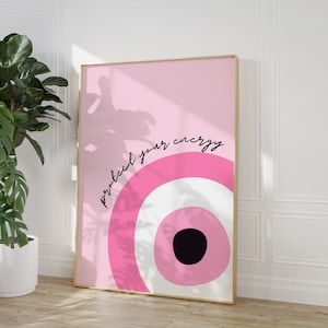 May include: Pink and white abstract art print with the text "protect your energy" in black cursive lettering. The print features a large circle with concentric rings in pink and white.