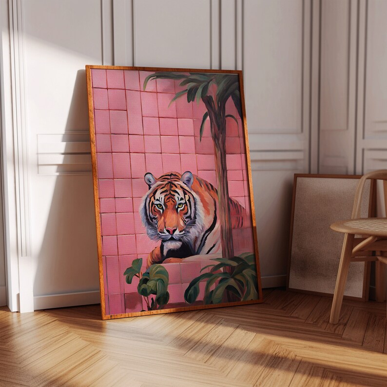 May include: A painting of a tiger sitting in front of a pink tiled wall. The tiger is looking directly at the viewer. The wall is decorated with a palm tree.