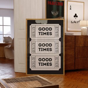 May include: A framed black and white print with three ticket stubs that read "GOOD TIMES" and the numbers "827830".