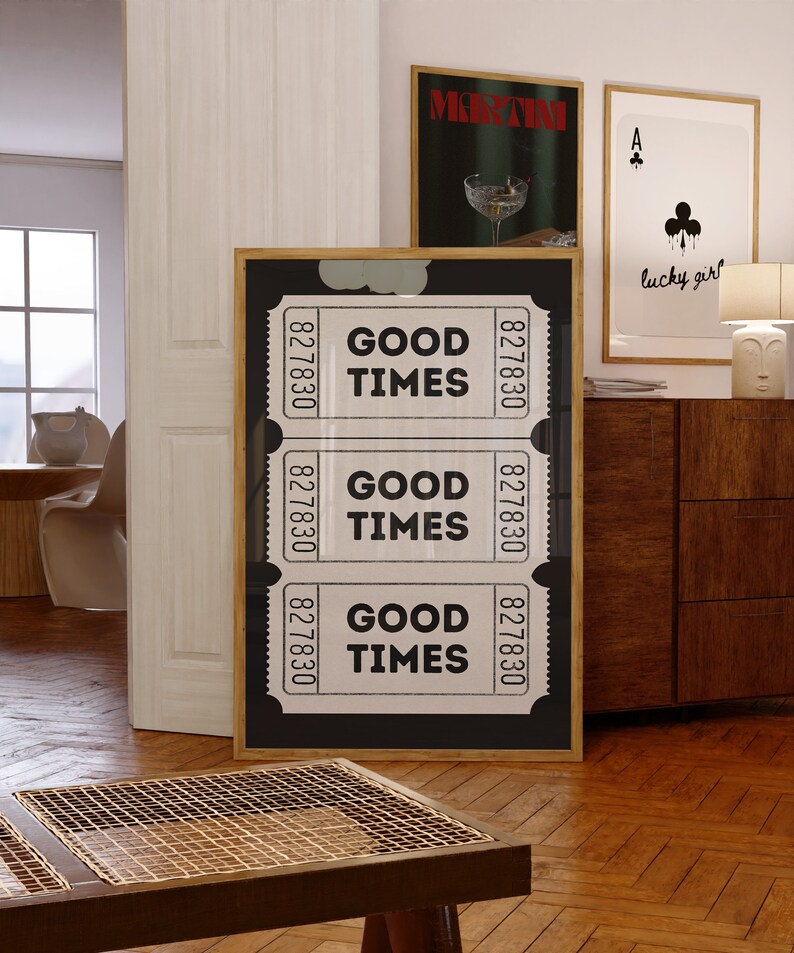 May include: A framed black and white print with three ticket stubs that read "GOOD TIMES" and the numbers "827830".
