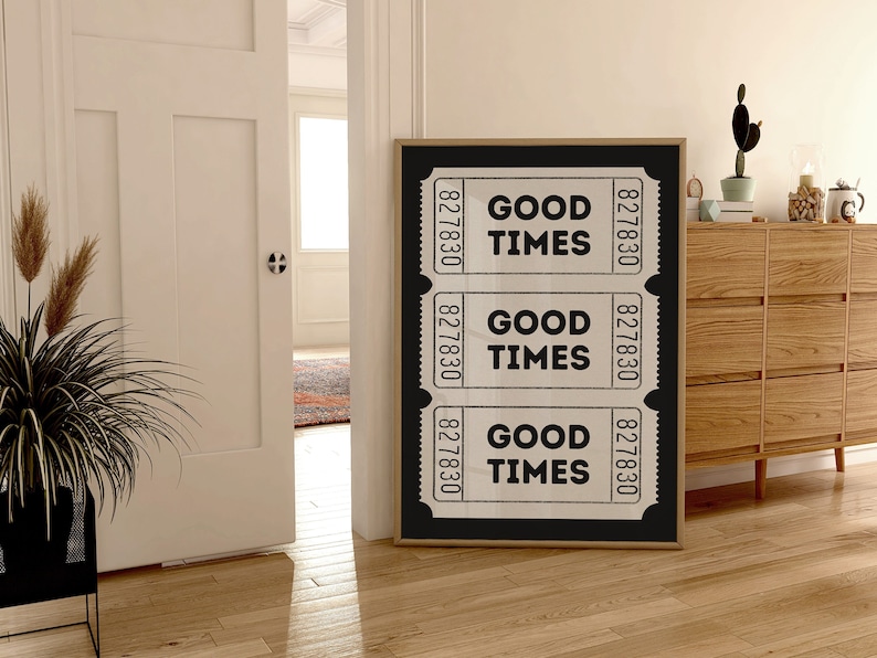 May include: Black and white poster with three vintage ticket stubs that say "Good Times" on a black background with a wooden frame.