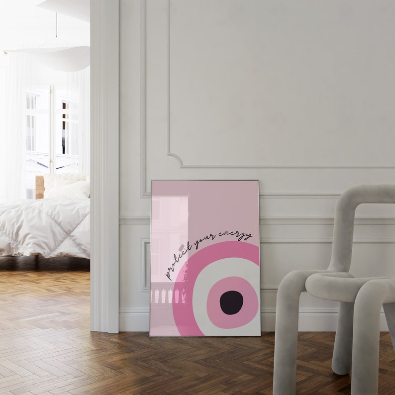 May include: Pink and white poster with a black circle in the center and the text "protect your energy" in black script.
