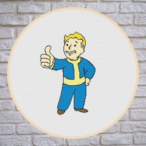 May include: A cross-stitch pattern of a cartoon character with blonde hair, wearing a blue jumpsuit and giving a thumbs up.