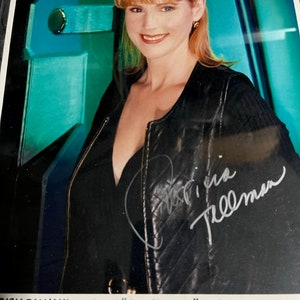 May include: A signed photograph of Patricia Tallman, a woman with red hair, wearing a black leather jacket. The photo includes the text "Patricia Tallman as telepath 'Lyta Alexander' on Babylon 5."