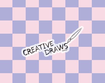 May include: A sticker with the text "CREATIVE DRAWS" in black, with a paintbrush illustration. The sticker is on a checkered background of light purple and pink squares. The word "Design" is below the paintbrush.